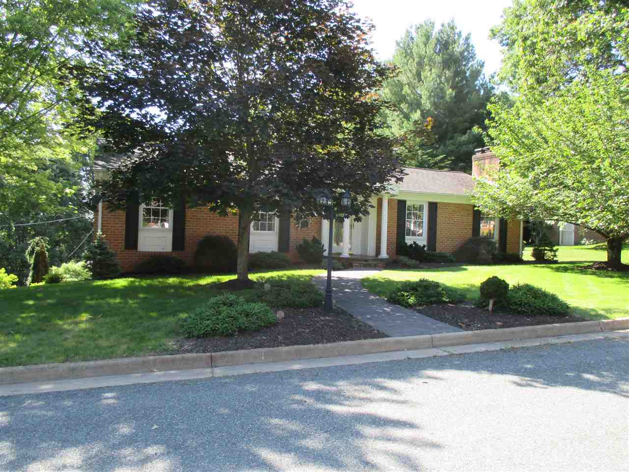 1220 Pinehurst Road Staunton, VA 24401 - Photo 1 of 24 a front view of a house with a yard and a garage