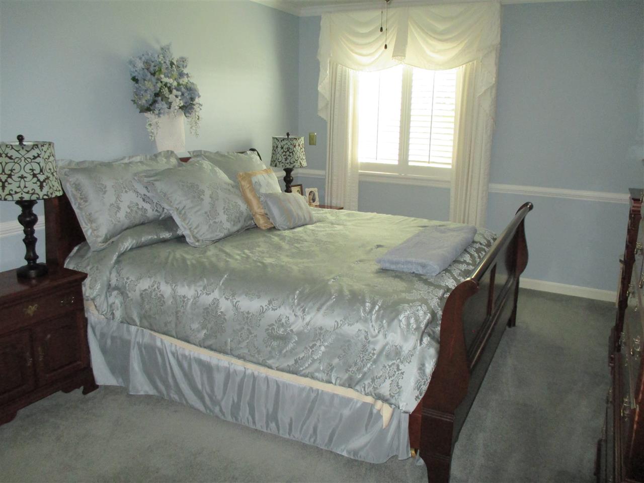 1220 Pinehurst Road Staunton, VA 24401 - Photo 11 of 24 a bed sitting in a bedroom next to a window
