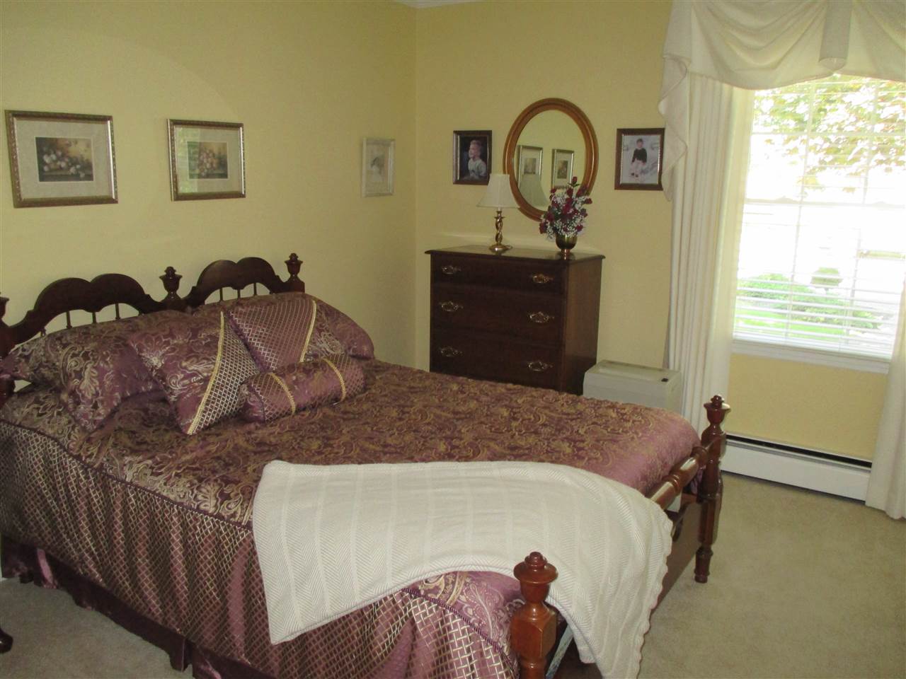 1220 Pinehurst Road Staunton, VA 24401 - Photo 13 of 24 a bedroom with a bed and a dresser next to a window