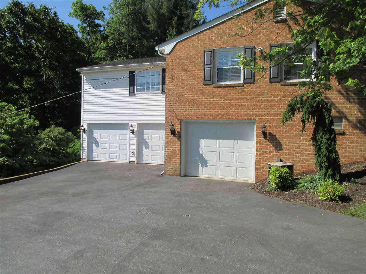 1220 Pinehurst Road Staunton, VA 24401 - Photo 21 of 24 a front view of a house with a yard and garage