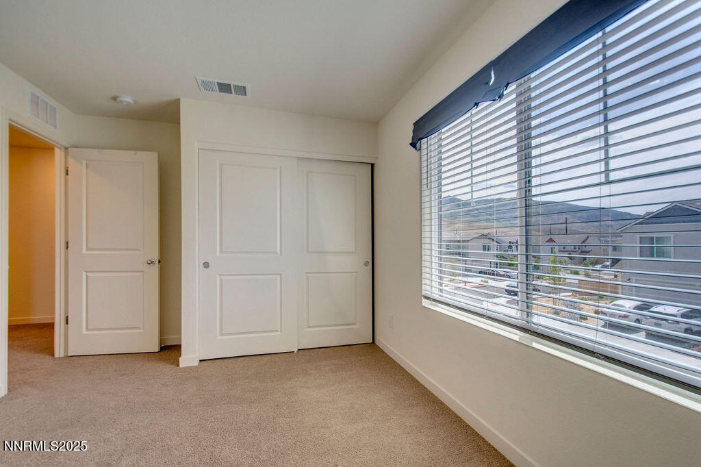 604 Selene Moon Street Reno, NV 89506 - Photo 14 of 40 a view of an empty room with a window