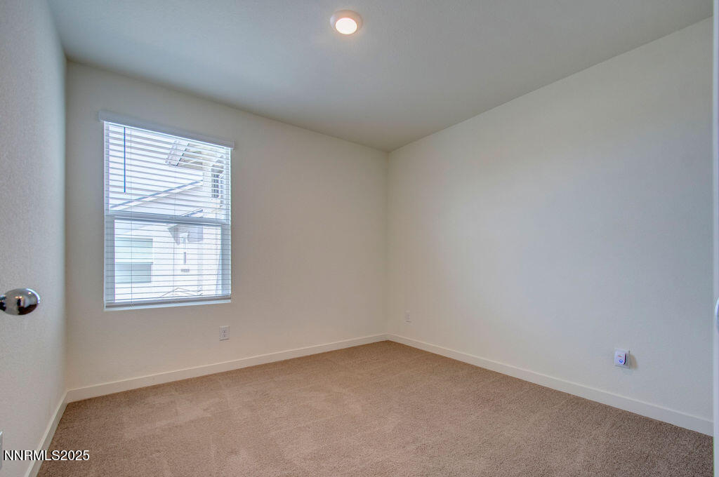 604 Selene Moon Street Reno, NV 89506 - Photo 15 of 40 an empty room with a window