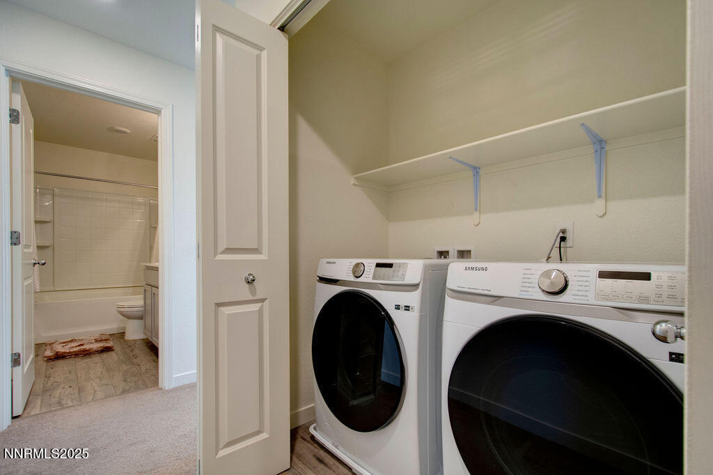 604 Selene Moon Street Reno, NV 89506 - Photo 17 of 40 a utility room with dryer and washer