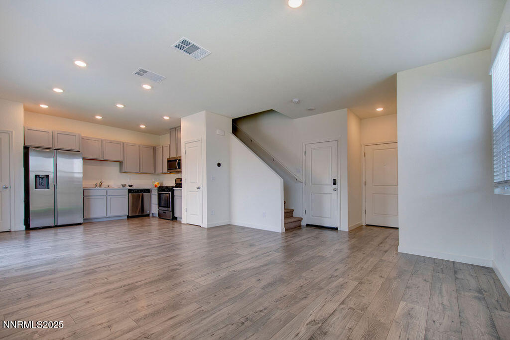 604 Selene Moon Street Reno, NV 89506 - Photo 2 of 40 a view of kitchen with wooden floor and electronic appliances