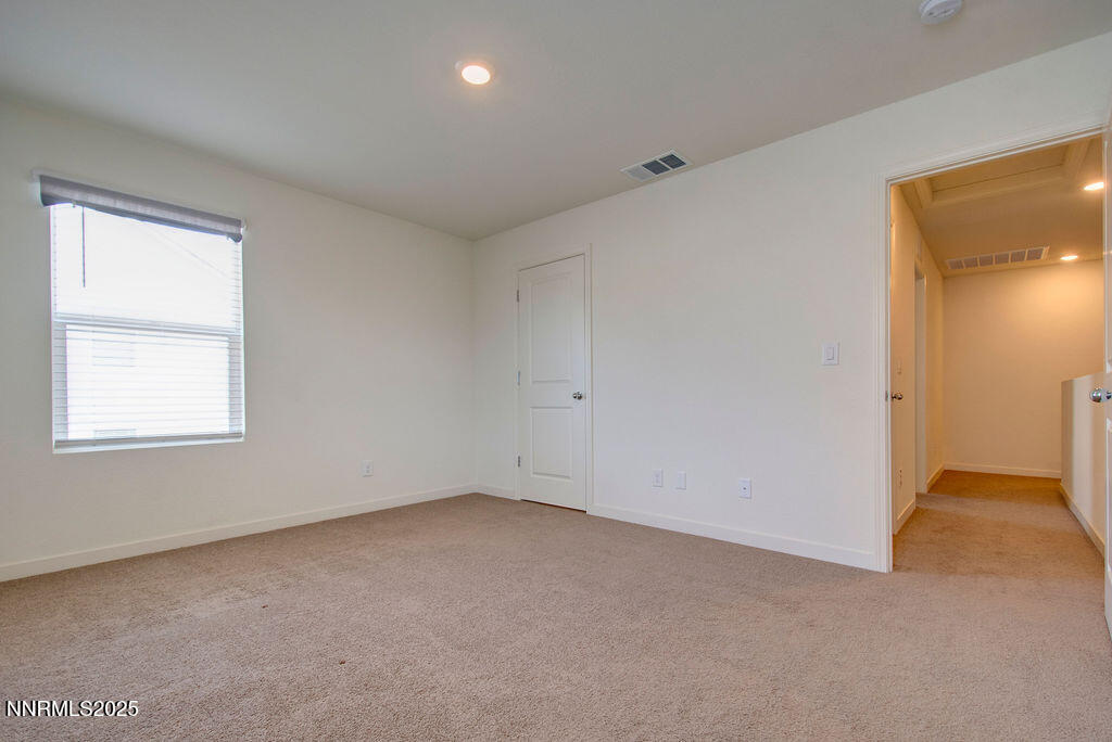 604 Selene Moon Street Reno, NV 89506 - Photo 22 of 40 an empty room with a window