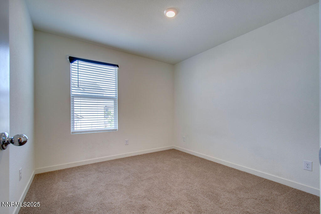 604 Selene Moon Street Reno, NV 89506 - Photo 23 of 40 an empty room with a window