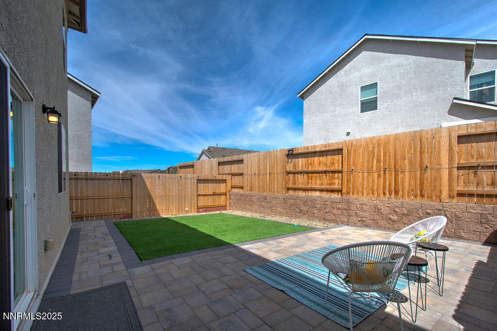 604 Selene Moon Street Reno, NV 89506 - Photo 29 of 40 a view of backyard with barbeque grill and wooden fence
