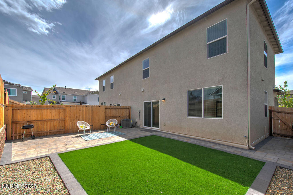604 Selene Moon Street Reno, NV 89506 - Photo 31 of 40 a front view of a house with a yard and a garage