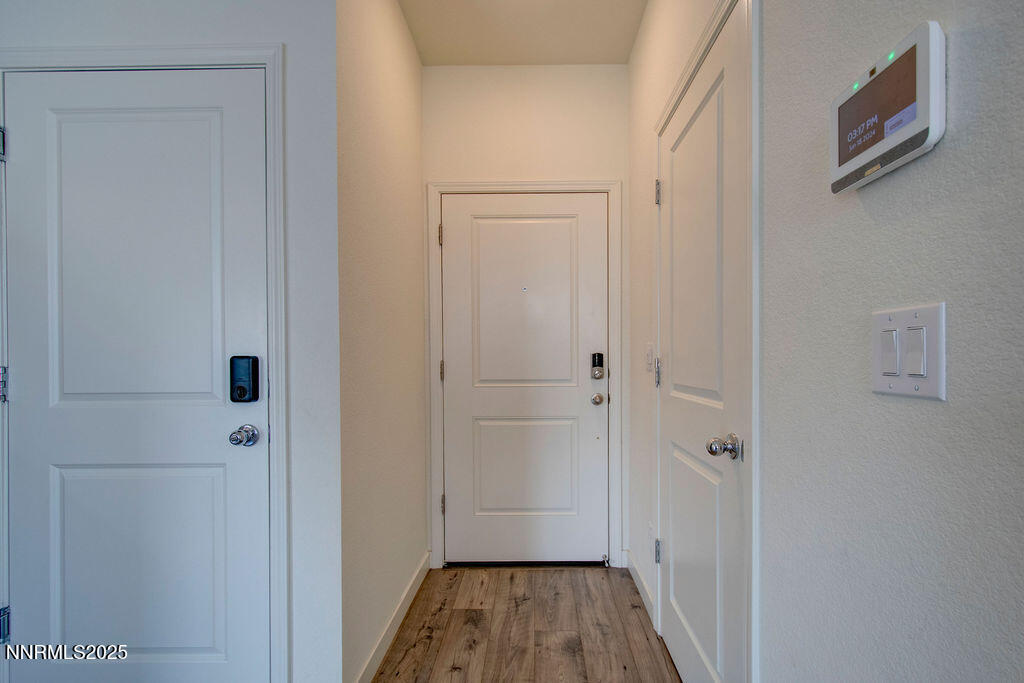 604 Selene Moon Street Reno, NV 89506 - Photo 8 of 40 a view of a hallway with wooden floor