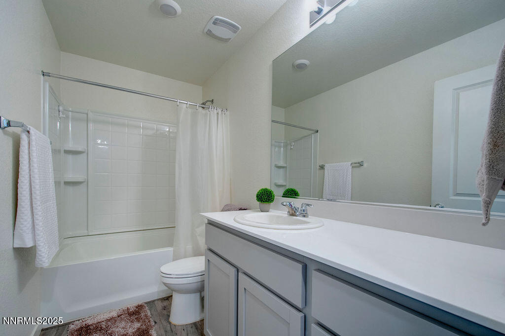 604 Selene Moon Street Reno, NV 89506 - Photo 9 of 40 a bathroom with a sink a toilet and shower