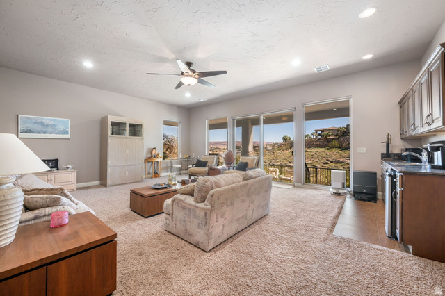 2376 Stone Crest Circle St. George, UT 84790 - Photo 32 of 61 Living room with light carpet, ceiling fan, and recessed lighting