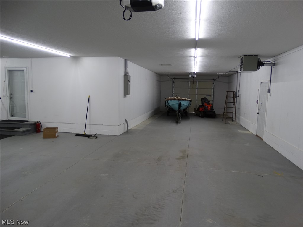 4100 Dayton Road Madison, OH 44057 - Photo 17 of 25 the extended garage with door to back yard. This is the 4th garage space.