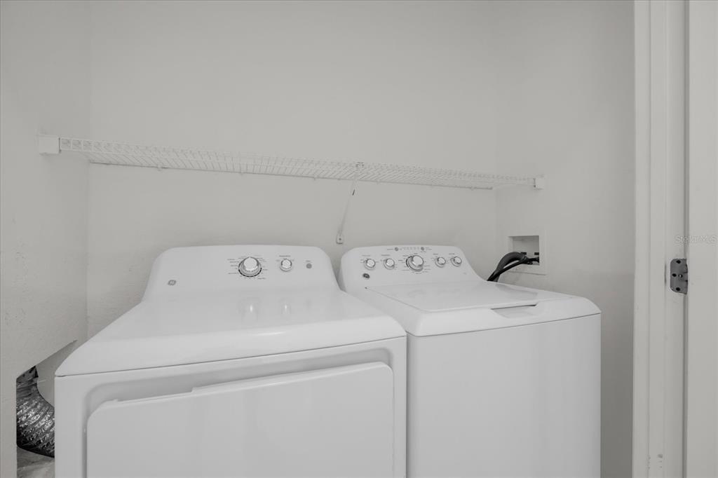 13500 Turtle Marsh Loop, Unit 811 Orlando, FL 32837 - Photo 16 of 23 a utility room with dryer and washer