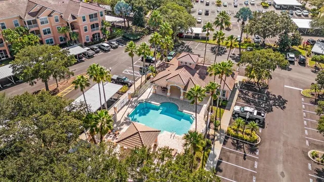 an aerial view of multiple houses with yard