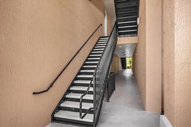 a view of entryway and gallery with wooden floor