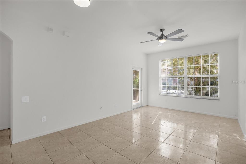 13500 Turtle Marsh Loop, Unit 811 Orlando, FL 32837 - Photo 4 of 23 a view of an empty room with a window