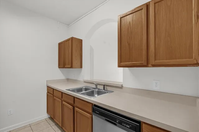 a kitchen with a sink and cabinets