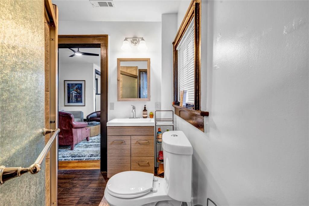 800 Myrtle Street Northeast Atlanta, GA 30308 - Photo 14 of 28 a bathroom with a sink a toilet and mirror