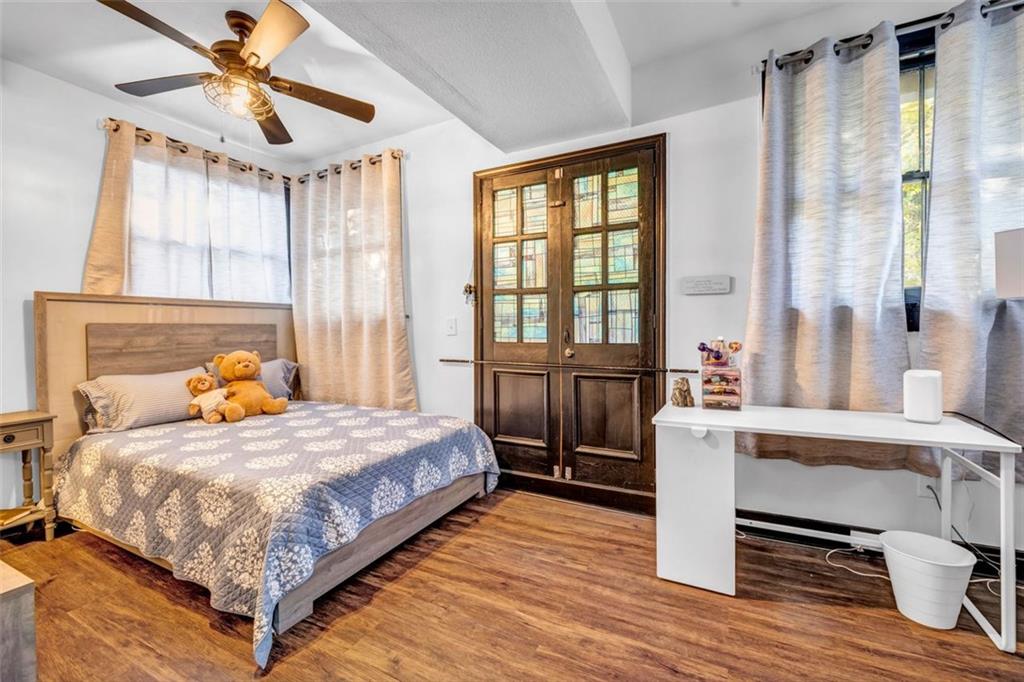 800 Myrtle Street Northeast Atlanta, GA 30308 - Photo 15 of 28 a bedroom with a bed and windows