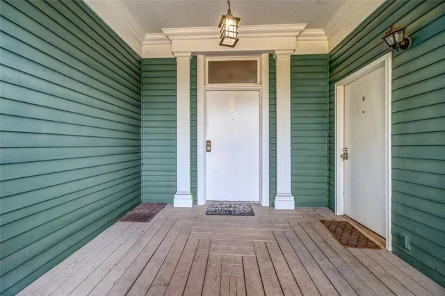 a view of a house with wooden deck