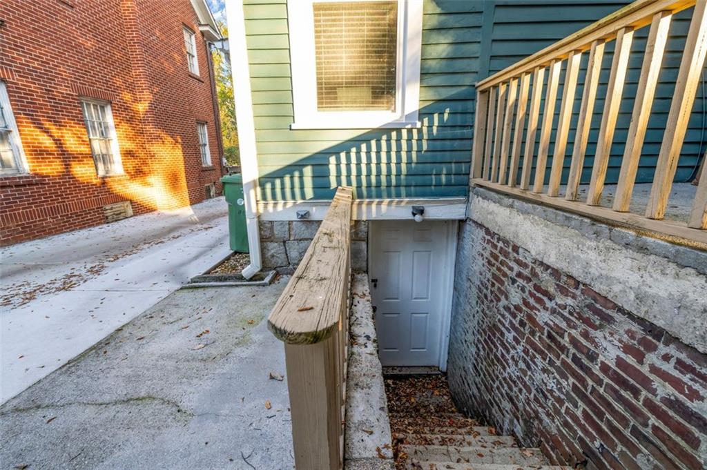 800 Myrtle Street Northeast Atlanta, GA 30308 - Photo 22 of 28 a stairs of a house with wooden floor