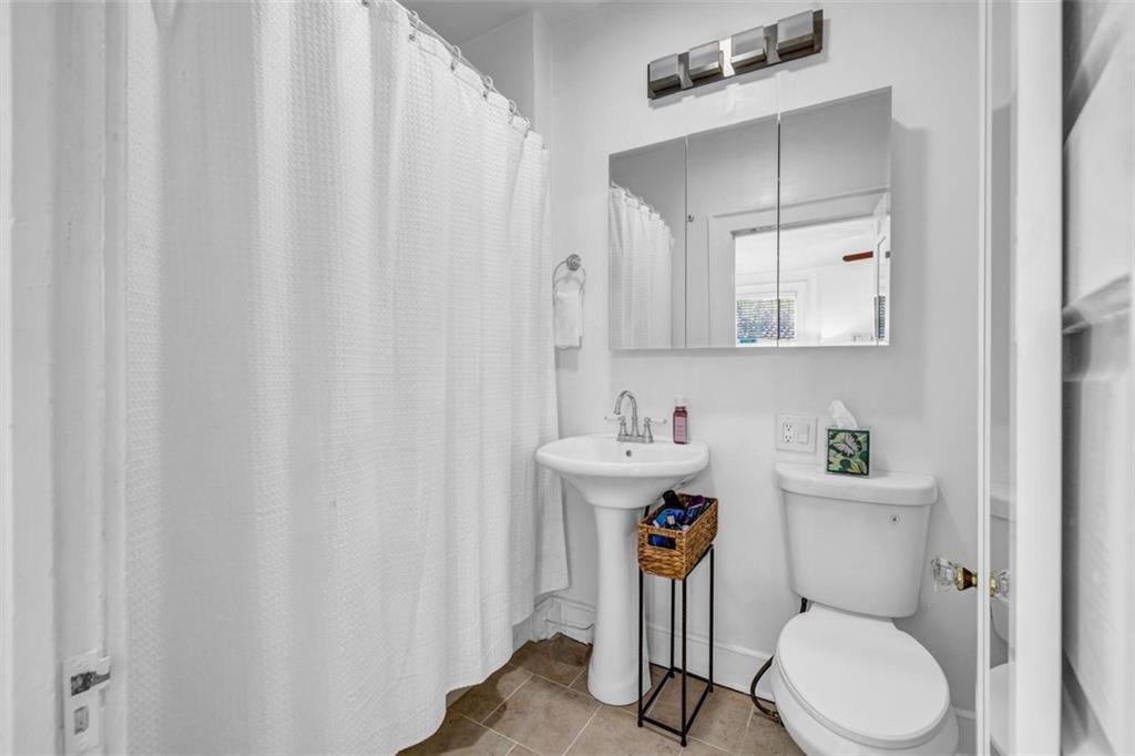 800 Myrtle Street Northeast Atlanta, GA 30308 - Photo 6 of 28 a white toilet sitting next to a bathroom sink