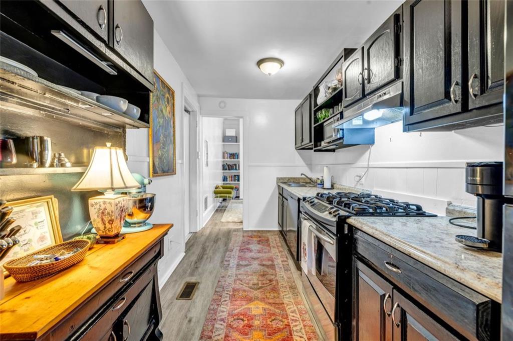 800 Myrtle Street Northeast Atlanta, GA 30308 - Photo 7 of 28 a kitchen with a stove and a sink