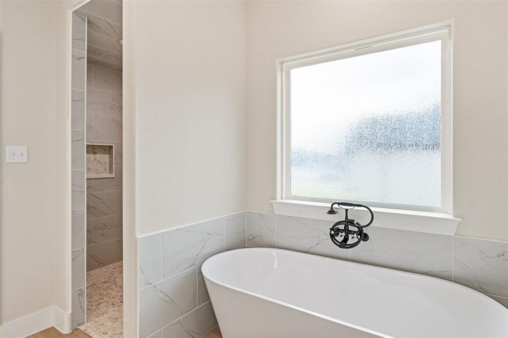 506 Limestone Circle Mabank, TX 75147 - Photo 15 of 33 a white bath tub sitting next to a window