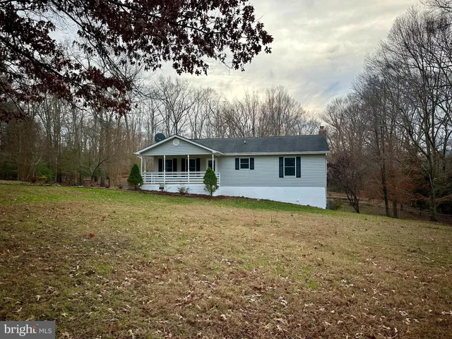 a house with trees in the background