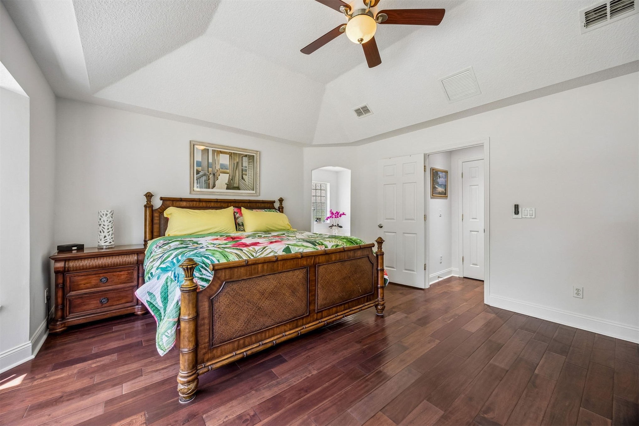 86107 Remsenburg Drive Fernandina Beach, FL 32034 - Photo 15 of 58 a bed sitting in a bedroom and wooden floor