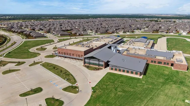 a view of a chairs and table in patio