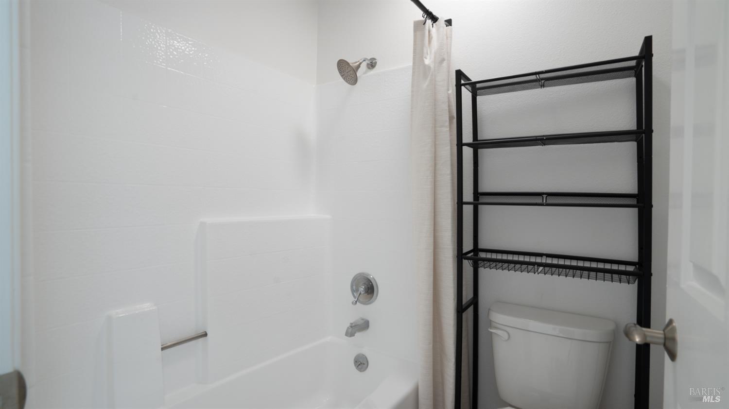 302 Mariner Way Novato, CA 94945 - Photo 16 of 20 a bathroom with a glass shower door