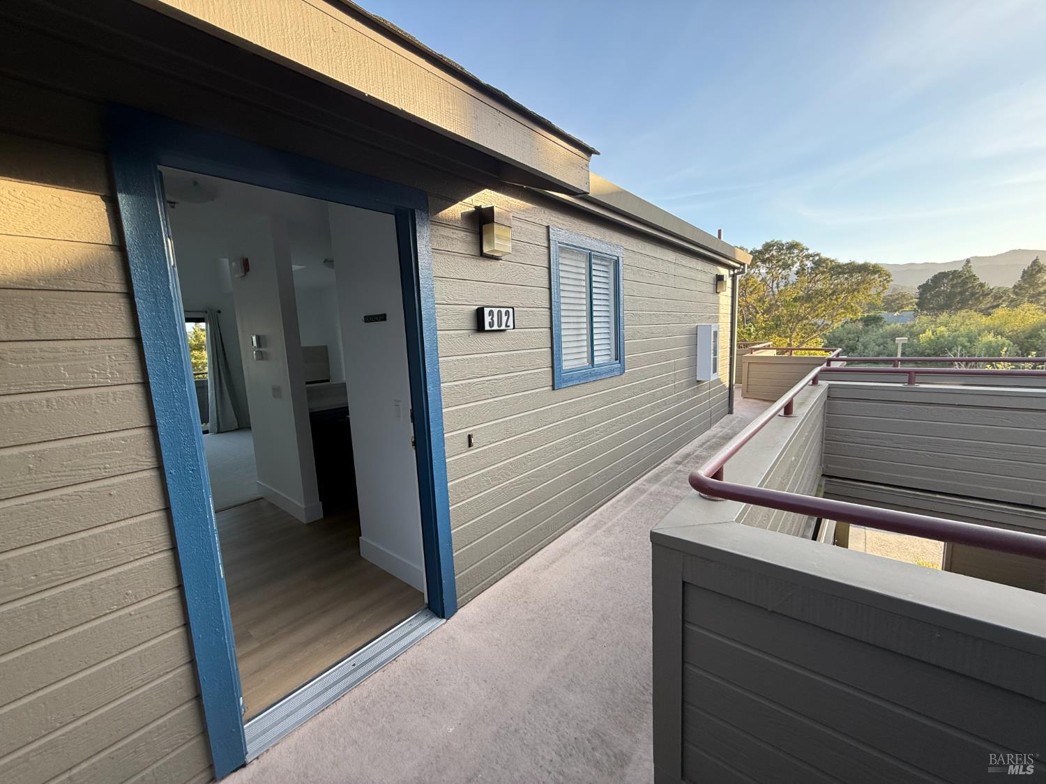 302 Mariner Way Novato, CA 94945 - Photo 5 of 20 a view of deck with a chair and floor to ceiling window