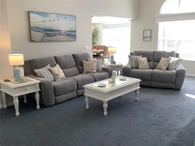 a living room with furniture and a table