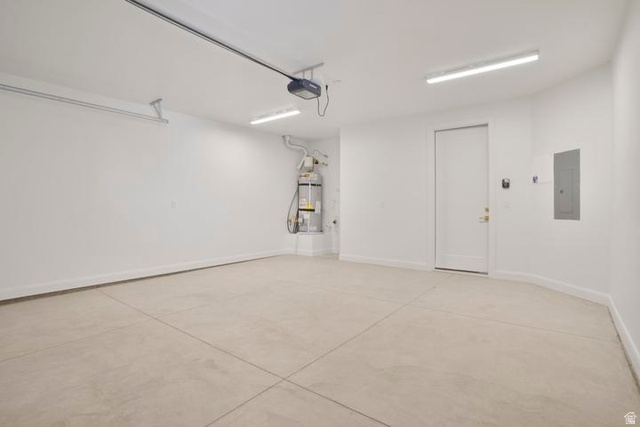 990 Manen Street Washington, UT 84780 - Photo 15 of 43 Spacious garage with concrete flooring, automatic garage door opener, and integrated utility access