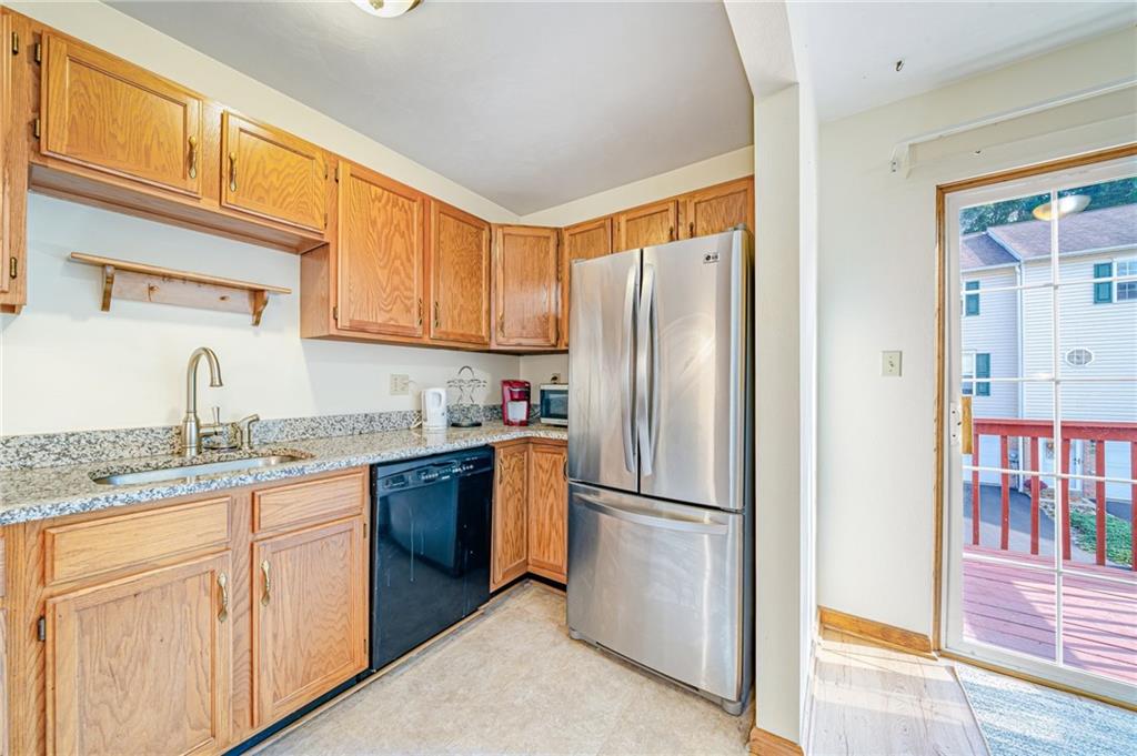 820 Mt Pleasant Road Greensburg, PA 15601 - Photo 12 of 30 a kitchen with stainless steel appliances granite countertop a refrigerator and a sink