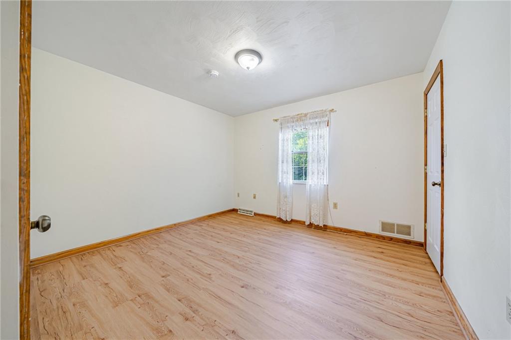820 Mt Pleasant Road Greensburg, PA 15601 - Photo 15 of 30 an empty room with wooden floor and windows
