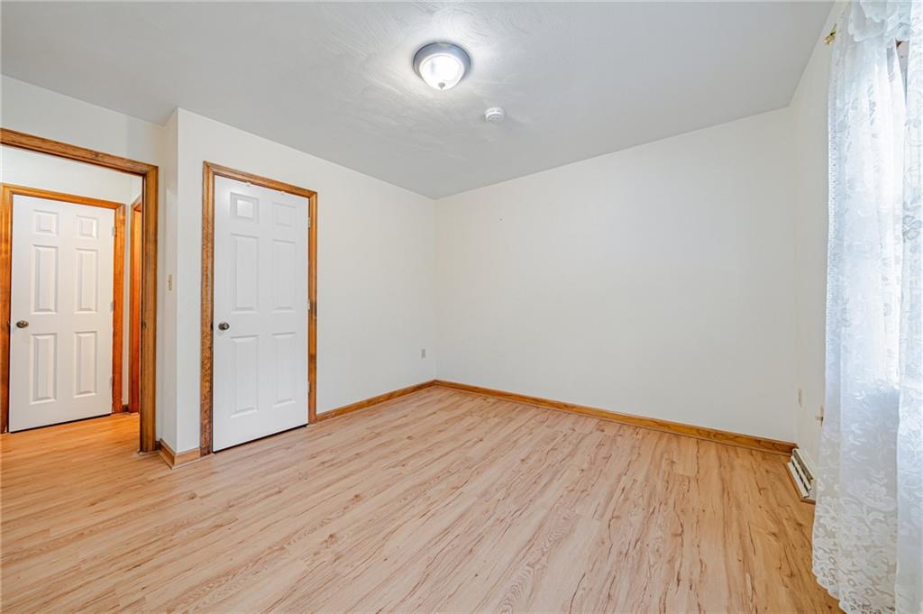 820 Mt Pleasant Road Greensburg, PA 15601 - Photo 16 of 30 an empty room with wooden floor and windows
