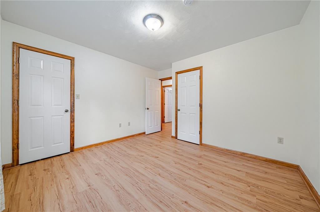 820 Mt Pleasant Road Greensburg, PA 15601 - Photo 17 of 30 an empty room with wooden floor and windows