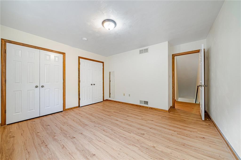 820 Mt Pleasant Road Greensburg, PA 15601 - Photo 20 of 30 a view of an empty room with wooden floor and closet