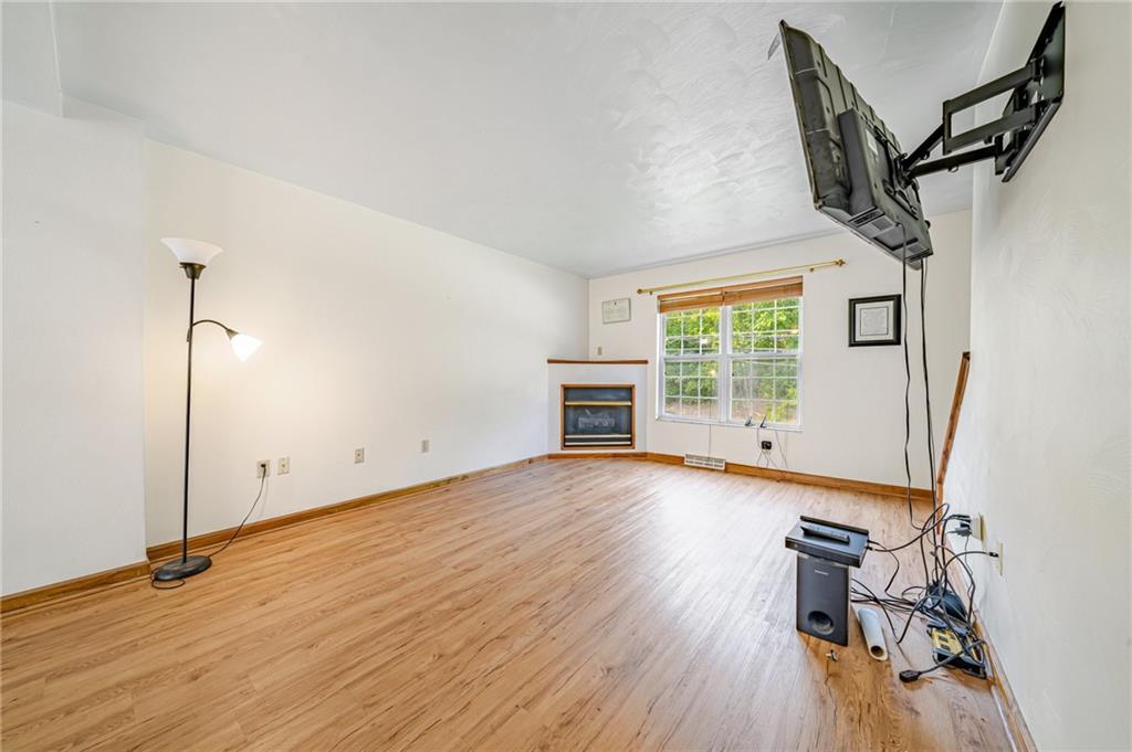 820 Mt Pleasant Road Greensburg, PA 15601 - Photo 2 of 30 an empty room with wooden floor and windows