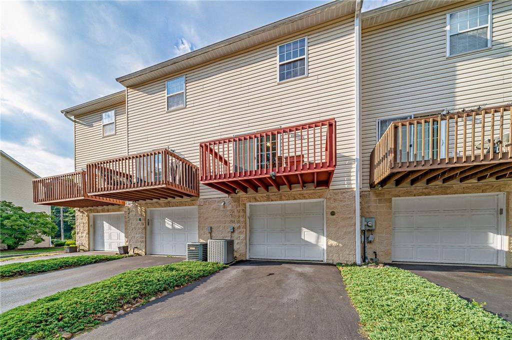 820 Mt Pleasant Road Greensburg, PA 15601 - Photo 30 of 30 a front view of a house with a garden and plants
