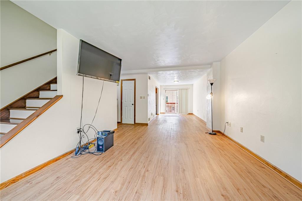 820 Mt Pleasant Road Greensburg, PA 15601 - Photo 5 of 30 a view of an empty room with wooden floor and stairs