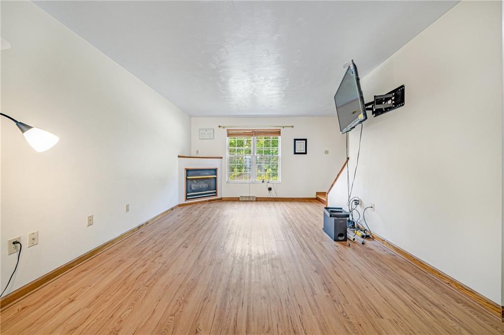 820 Mt Pleasant Road Greensburg, PA 15601 - Photo 6 of 30 wooden floor in an empty room with a window