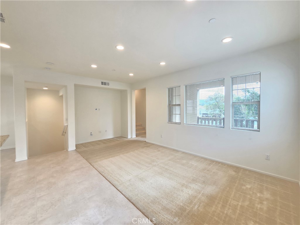 879 Iris Way, Unit A Azusa, CA 91702 - Photo 3 of 21 an empty room with windows