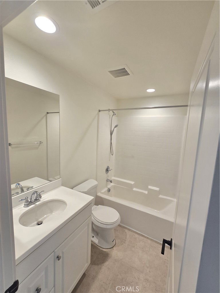 879 Iris Way, Unit A Azusa, CA 91702 - Photo 9 of 21 a bathroom with a sink a toilet and shower
