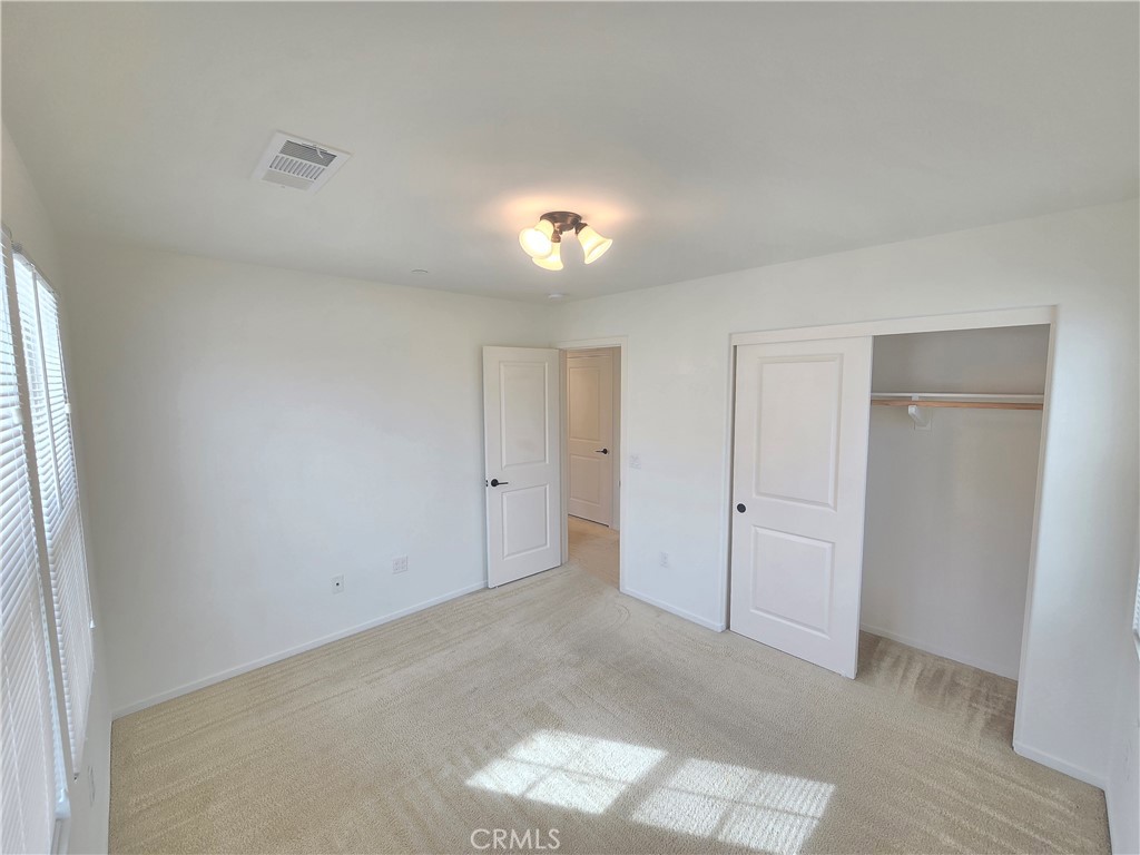 879 Iris Way, Unit A Azusa, CA 91702 - Photo 10 of 21 a view of an empty room
