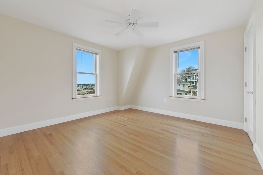 16 Burr Road Hull, MA 02045 - Photo 16 of 25 an empty room with windows and closet