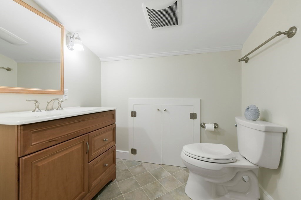 16 Burr Road Hull, MA 02045 - Photo 22 of 25 a bathroom with a sink a toilet and shower