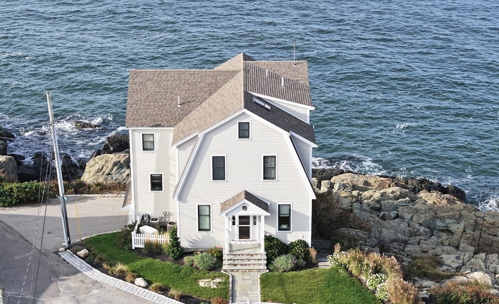 16 Burr Road Hull, MA 02045 - Photo 23 of 25 a view of a white house with a yard